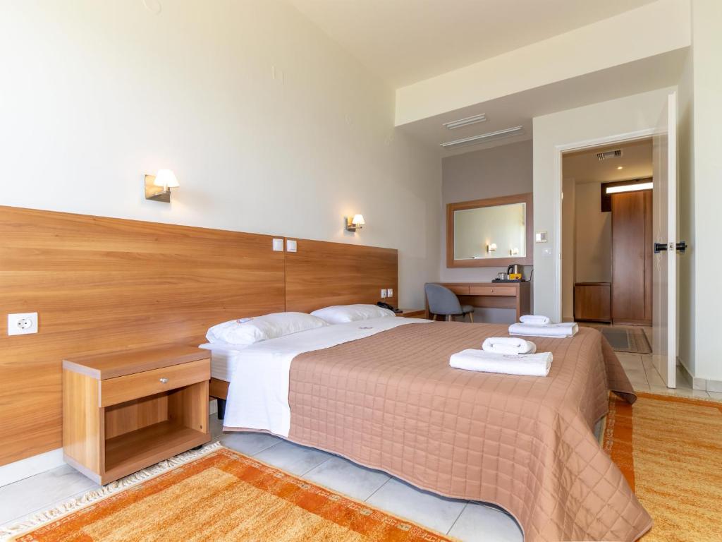 Postel nebo postele na pokoji v ubytování Sunset Hotel