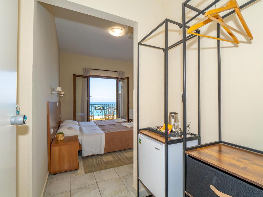 Postel nebo postele na pokoji v ubytování Sunset Hotel