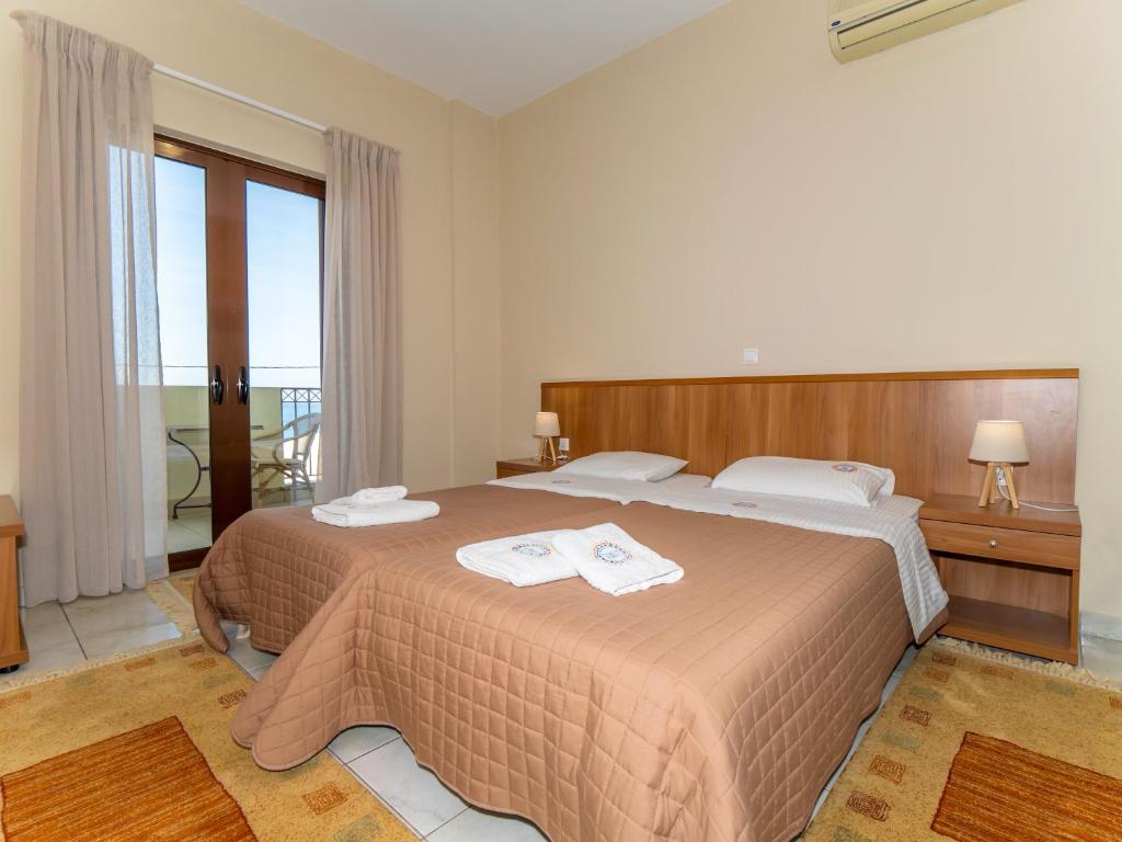 Postel nebo postele na pokoji v ubytování Sunset Hotel
