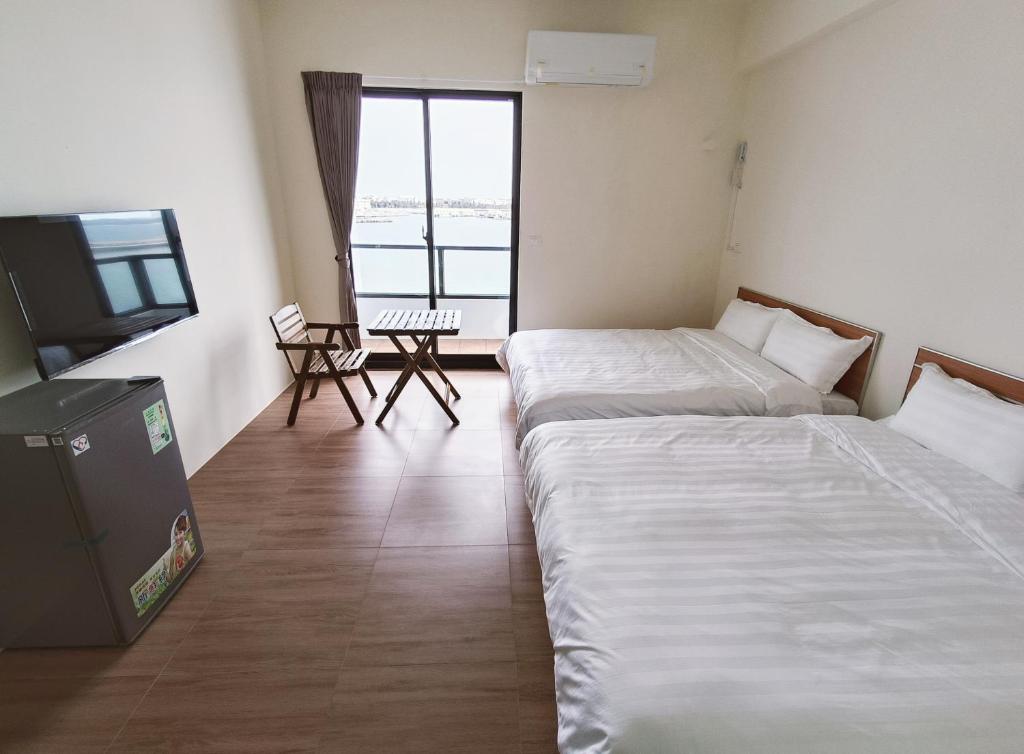 Postel nebo postele na pokoji v ubytování Endless Summer Homestay