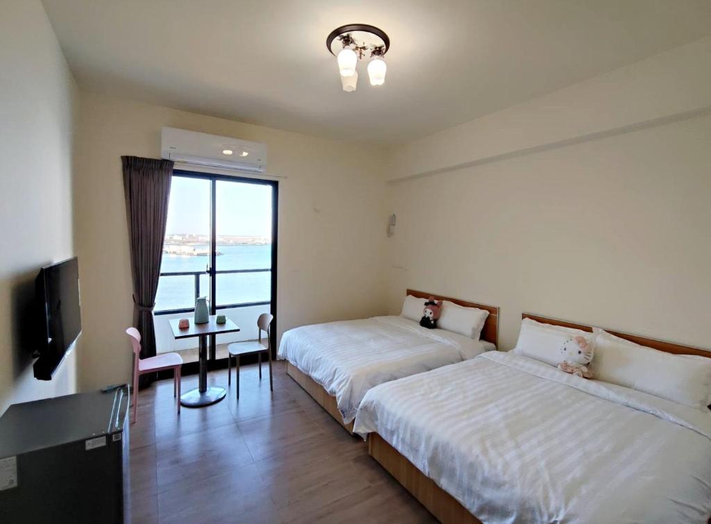 Postel nebo postele na pokoji v ubytování Endless Summer Homestay