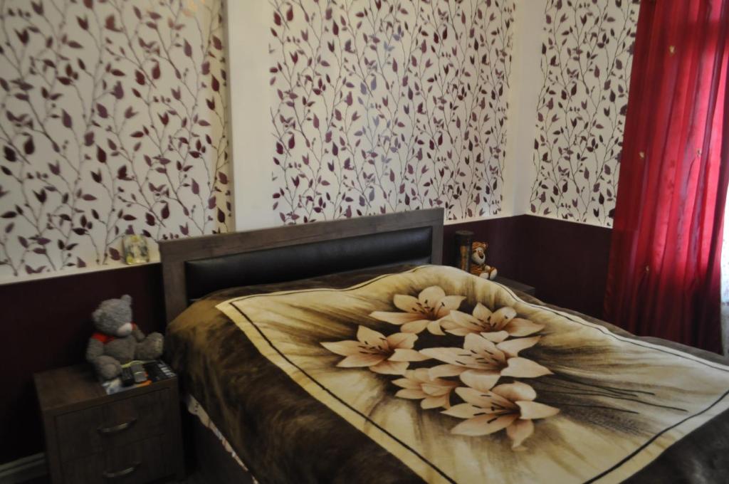 Postel nebo postele na pokoji v ubytování Guesthouse Dariali