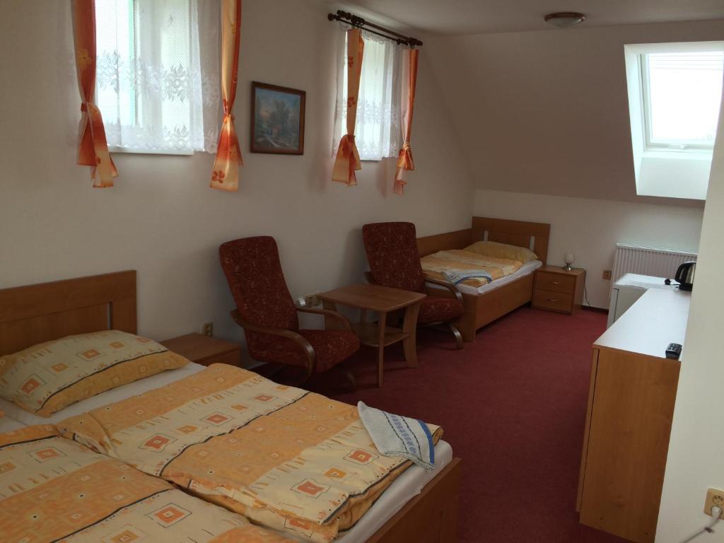 Postel nebo postele na pokoji v ubytování Penzion Rakovec