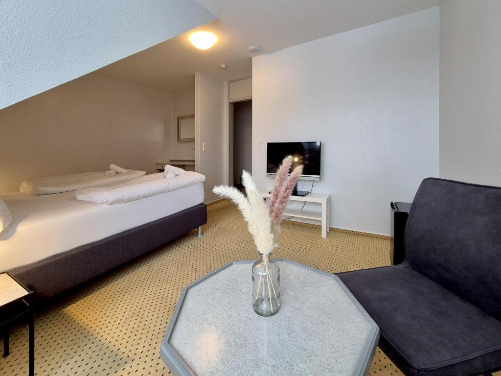 Postel nebo postele na pokoji v ubytování Hotel Schachener Hof