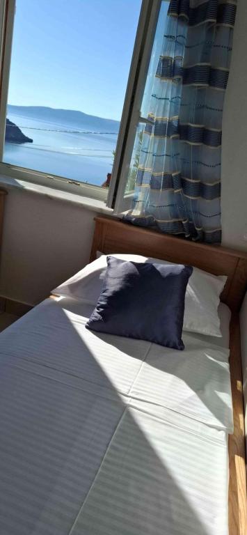 Postel nebo postele na pokoji v ubytování Apartments Lidija