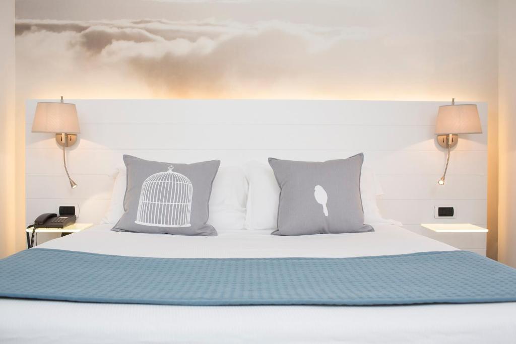 Postel nebo postele na pokoji v ubytování Ariae Dépendance - Alihotels