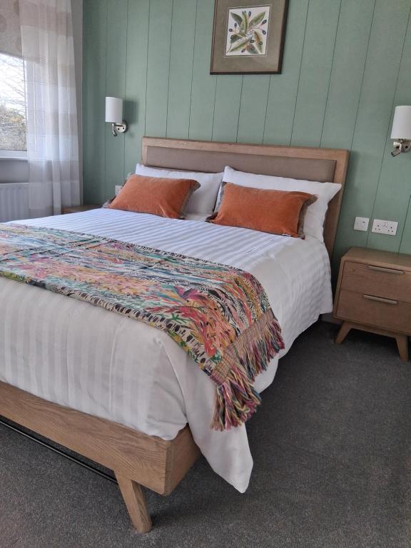 Postel nebo postele na pokoji v ubytování Donemark Rise B&B