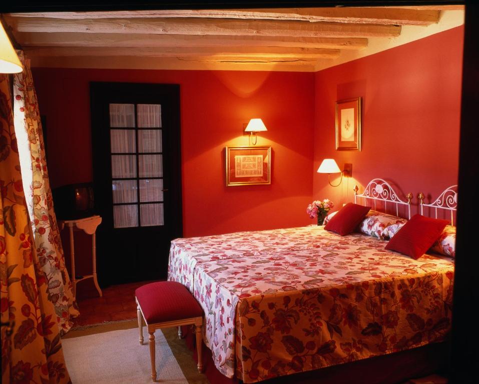 Postel nebo postele na pokoji v ubytování Hotel Caserío de Lobones