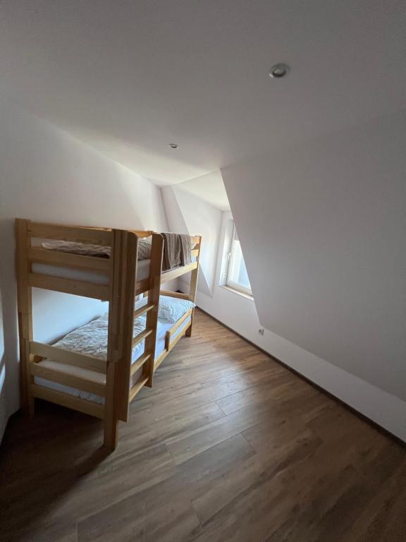 a room with two bunk beds in the attic at Bestdrive Pokój 13 in Babienica