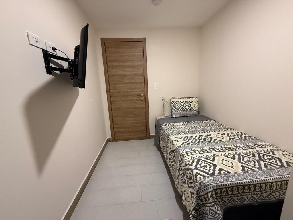 Postel nebo postele na pokoji v ubytování New and Luxurious Apt in Cipreses de San Ignacio