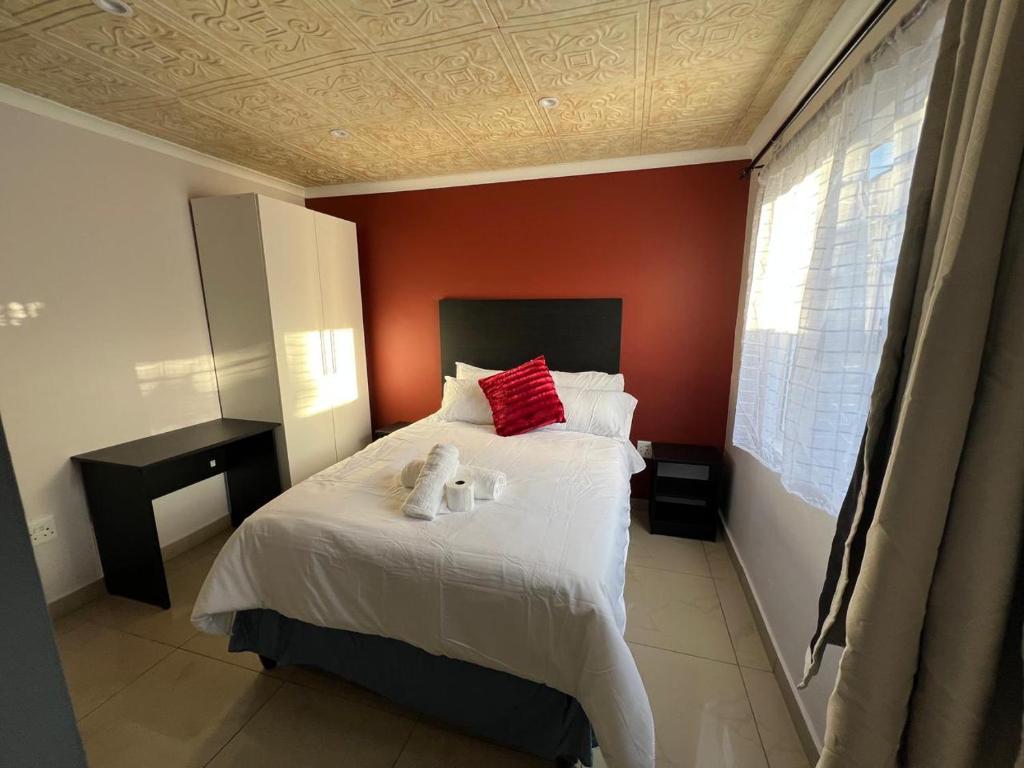 Ένα ή περισσότερα κρεβάτια σε δωμάτιο στο Our Home Guest House