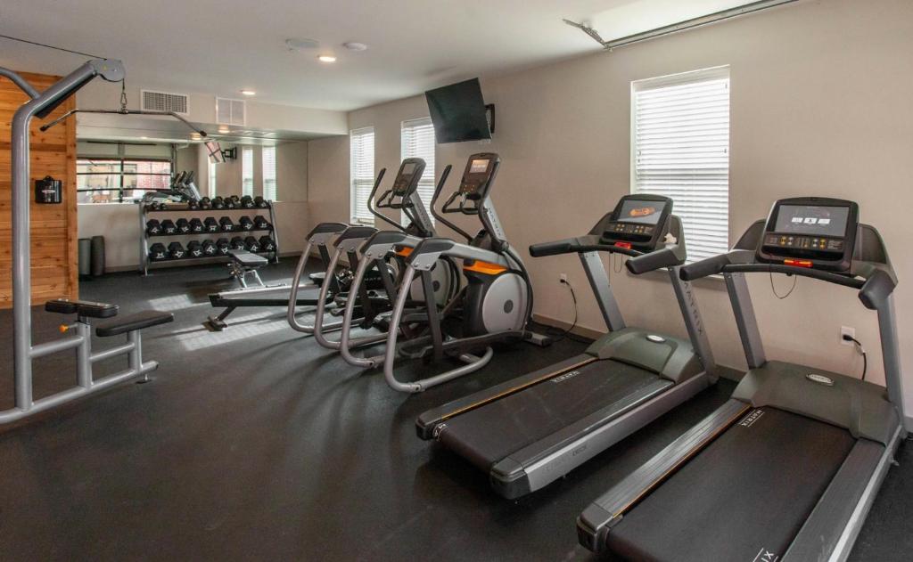 a gym with several tread machines in a room at Sleepover 1BD 1BA North Little Rock Apartments in North Little Rock