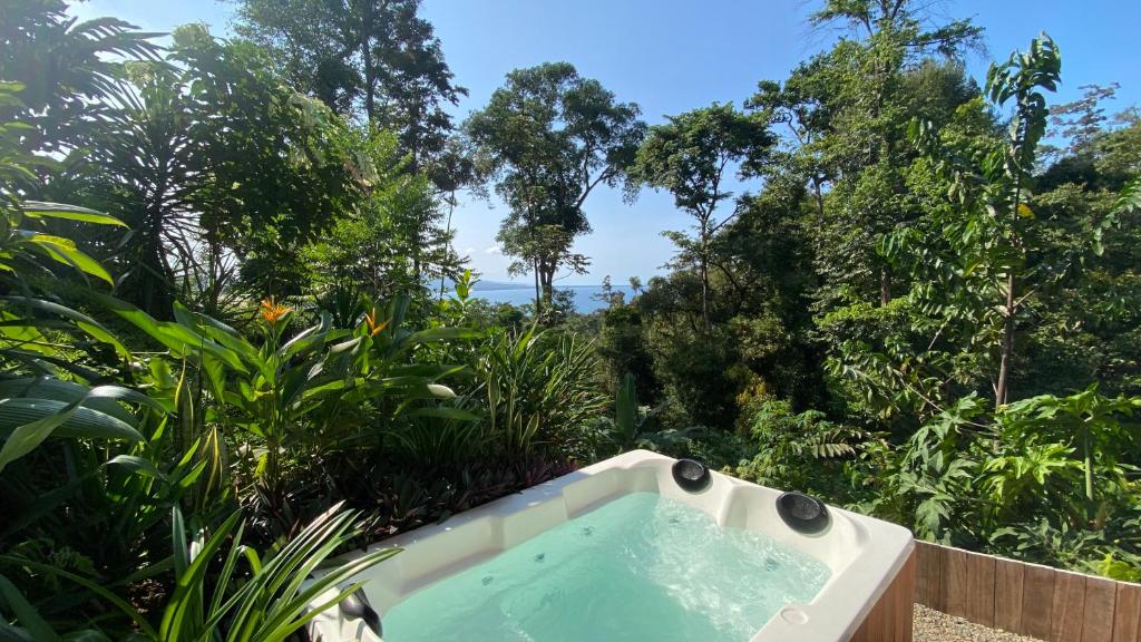 a bath tub in the middle of a forest at Tropical Sea View Villa in Puerto Viejo