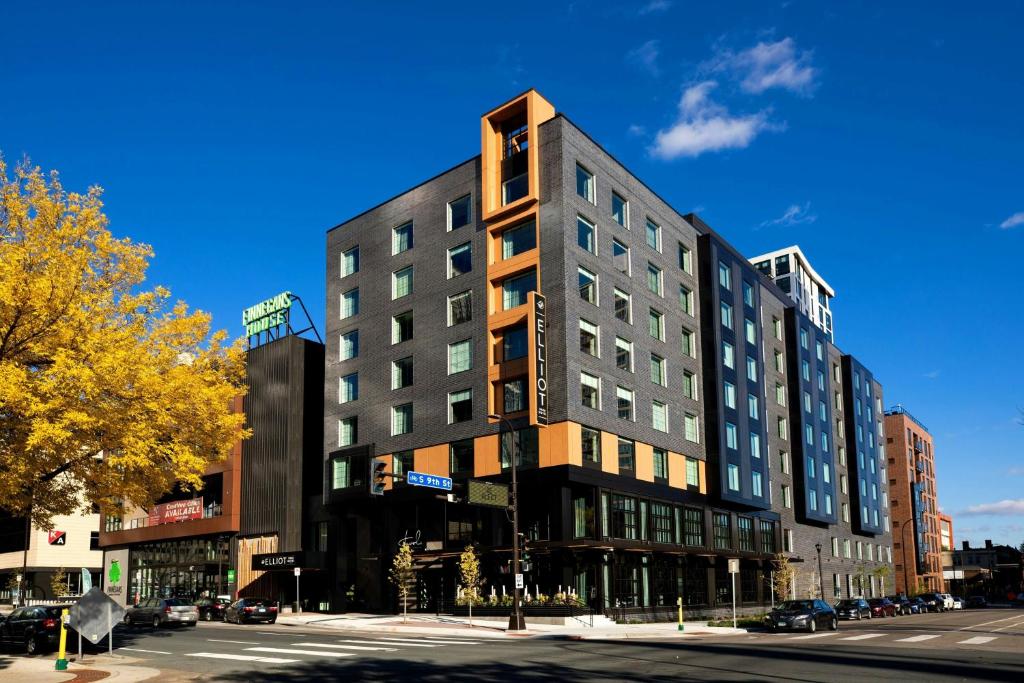 a tall building on a city street with at Elliot Park Hotel, Autograph Collection in Minneapolis