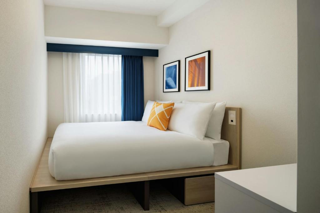 Postel nebo postele na pokoji v ubytování Four Points Flex by Sheraton Utsunomiya