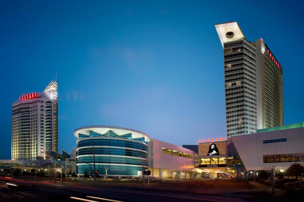 a group of tall buildings in a city at night at Caesars Windsor Hotel & Casino - A Caesars Rewards Destination in Windsor