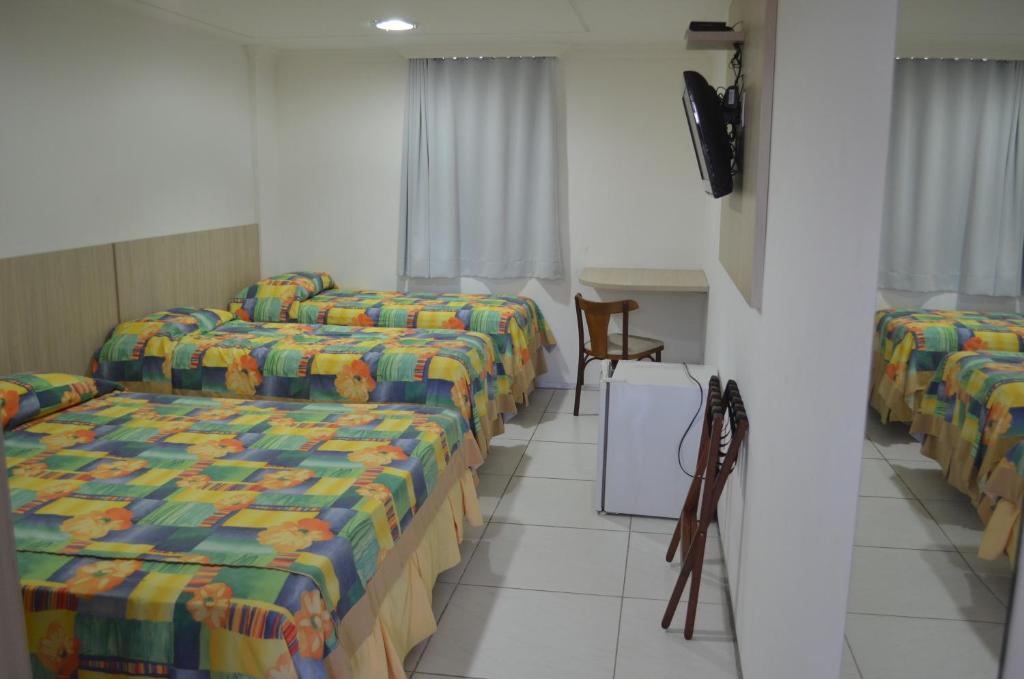Cama ou camas em um quarto em Annamar Hotel