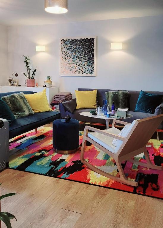 a living room with a couch and a table at Cally Flat in London