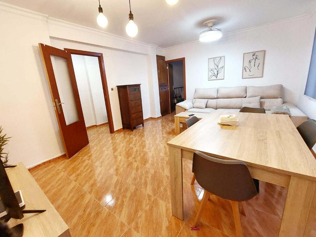 a living room with a table and a couch at Hansome flat in Ceuta