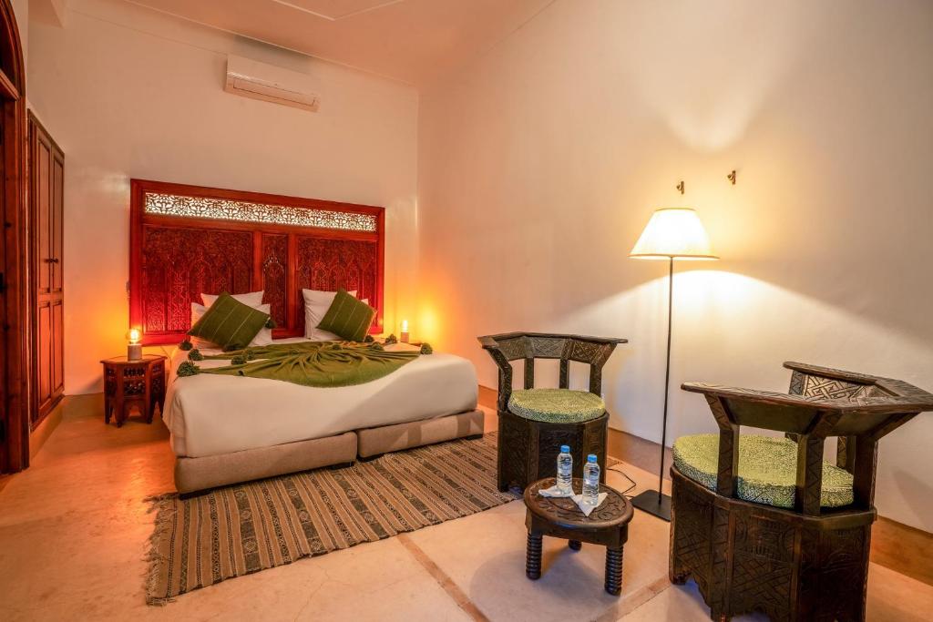En eller flere senger på et rom på Riad Adika & Spa
