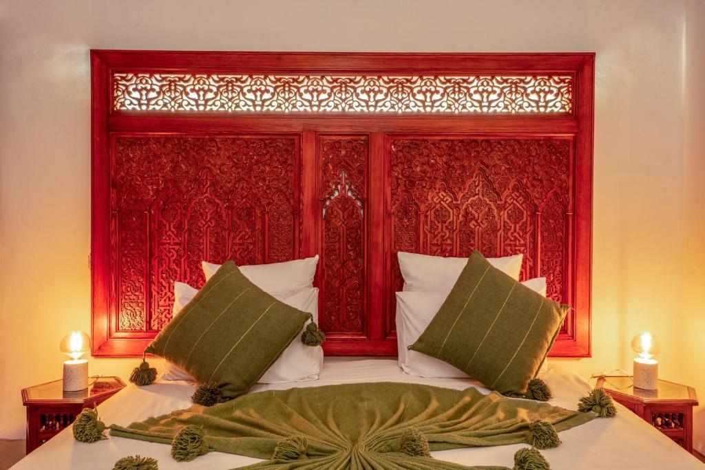 En eller flere senger på et rom på Riad Adika & Spa