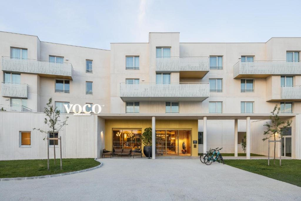 a rendering of the front of a building at voco Beaune , Cité des Vins by IHG in Beaune