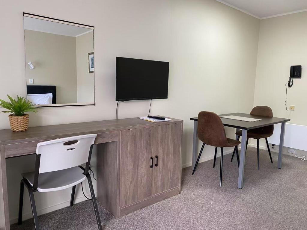 TV a/nebo společenská místnost v ubytování Malones Spa Motel
