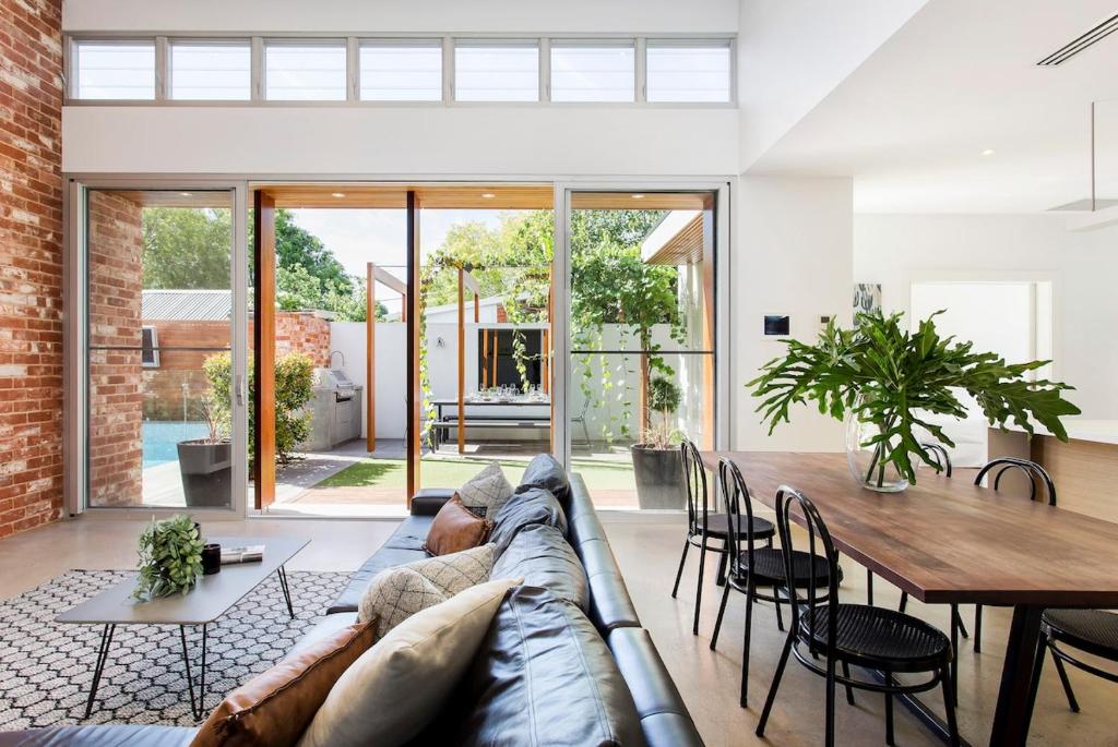 a living room with a couch and a table at Norwood Haven- Pool - Pet Friendly & Free WiFi in Norwood