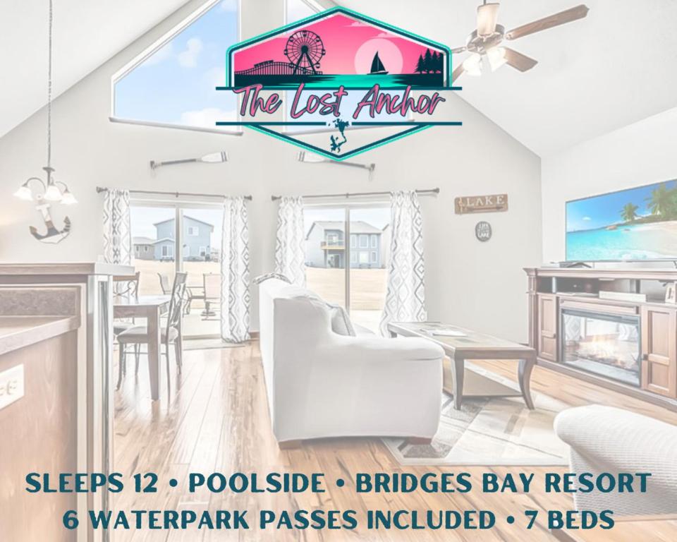 a living room with a kitchen and a dining room at The Anchor Poolside at Bridges Bay Resort in Arnolds Park