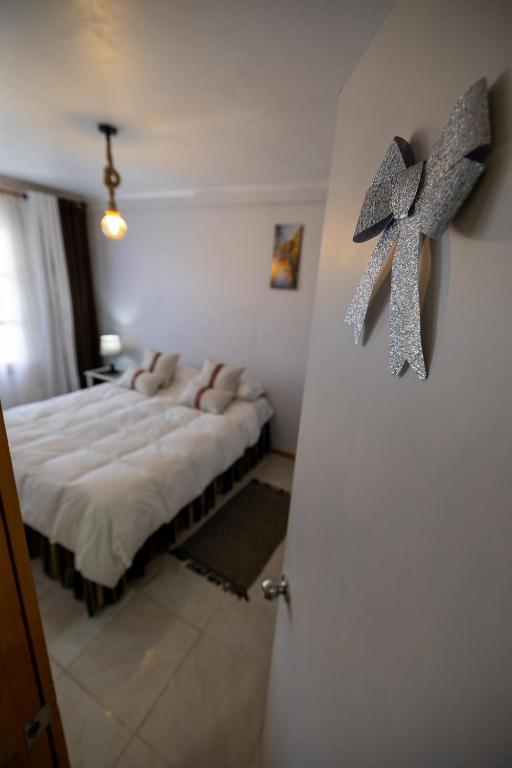 Postel nebo postele na pokoji v ubytování Hostal Ruta del Desierto