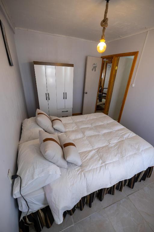 Postel nebo postele na pokoji v ubytování Hostal Ruta del Desierto