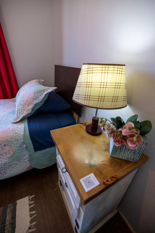 Postel nebo postele na pokoji v ubytování Hostal Ruta del Desierto