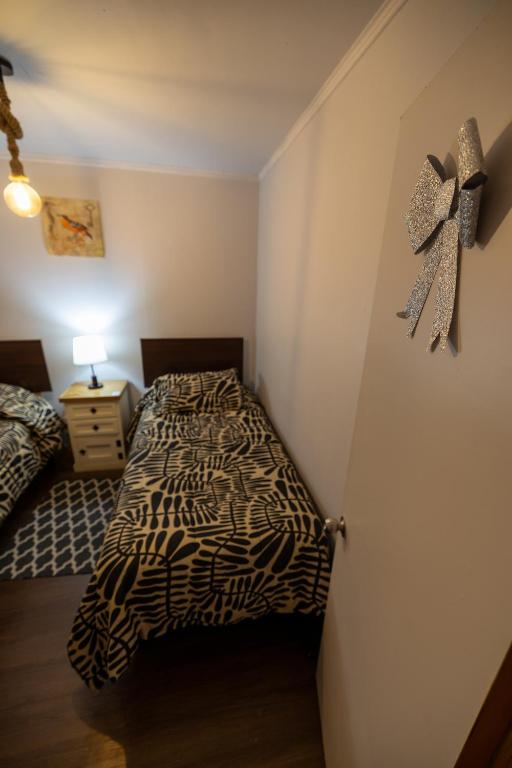 Postel nebo postele na pokoji v ubytování Hostal Ruta del Desierto