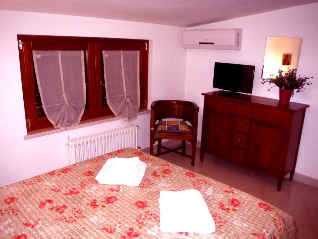 Postel nebo postele na pokoji v ubytování Casa Vacanze Villa Pina