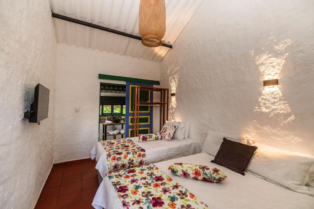 Postel nebo postele na pokoji v ubytování Hotel campestre La Esperanza en Dios