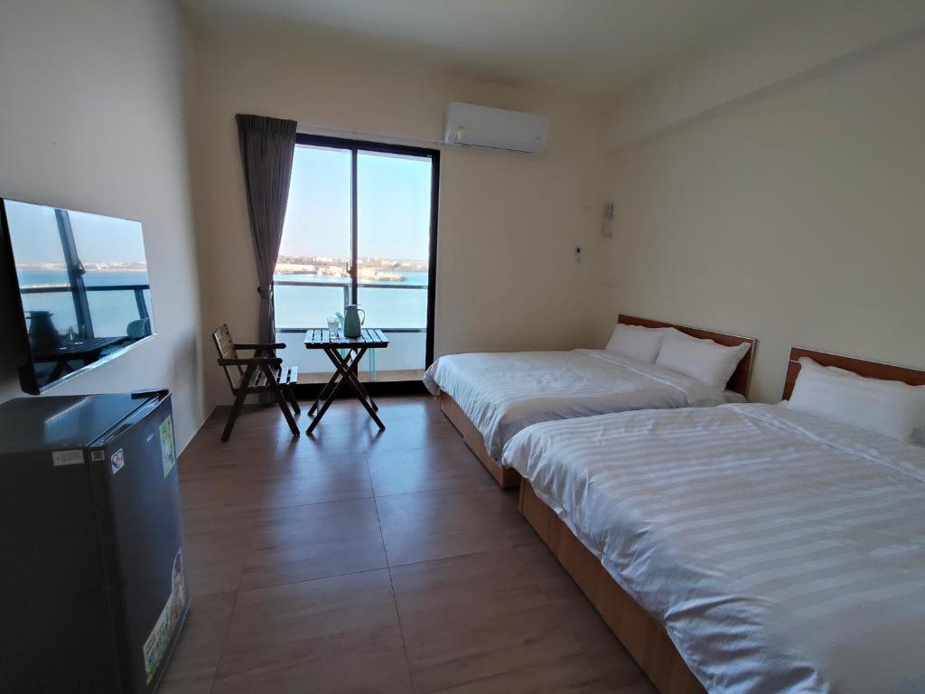 Postel nebo postele na pokoji v ubytování Endless Summer Homestay