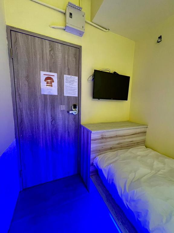Postel nebo postele na pokoji v ubytování Art Inn - Kaifeng