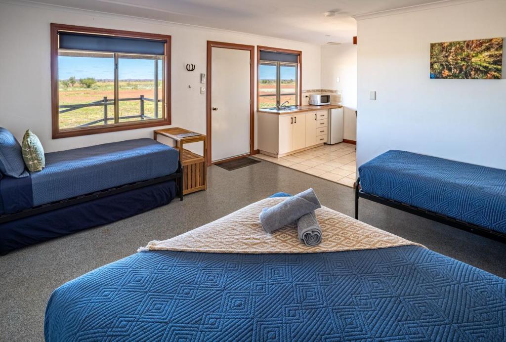 Ένα ή περισσότερα κρεβάτια σε δωμάτιο στο Cheela Plains Station Stay