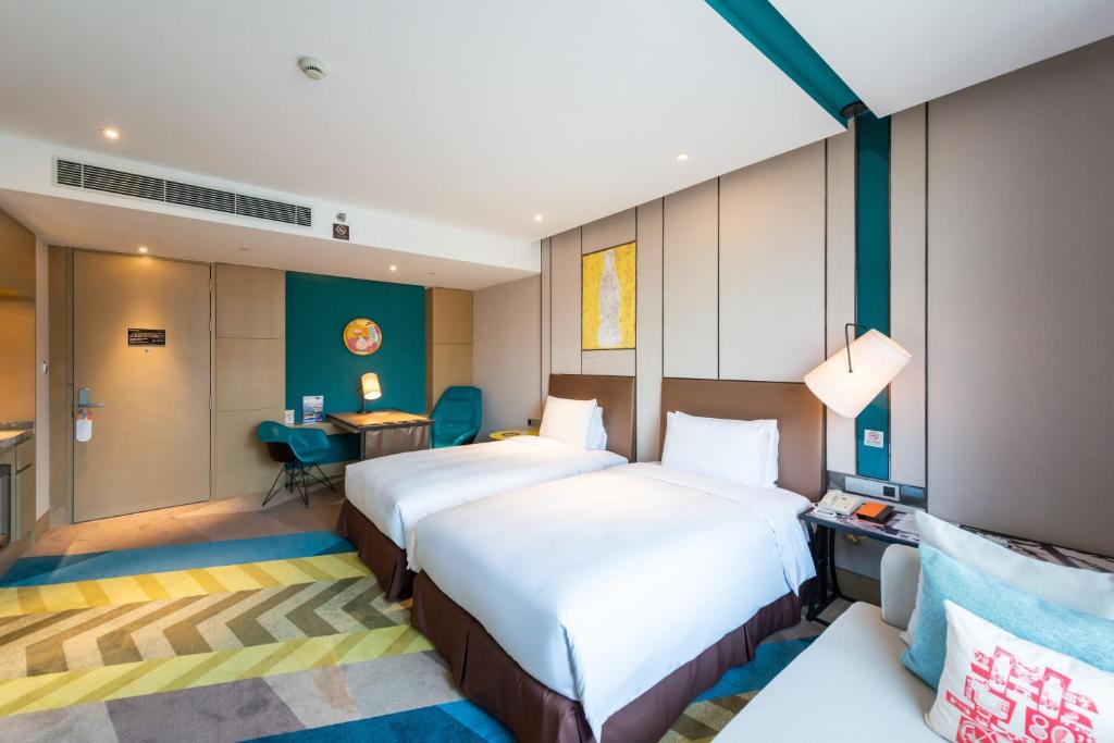 Postel nebo postele na pokoji v ubytování MiniMax Premier Hotel Shanghai Hongqiao
