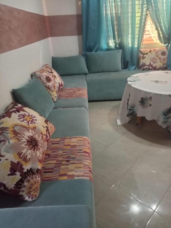 a living room with a couch and a table at Saidia in Saïdia