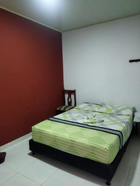 Postel nebo postele na pokoji v ubytování HOSTAL SARITA