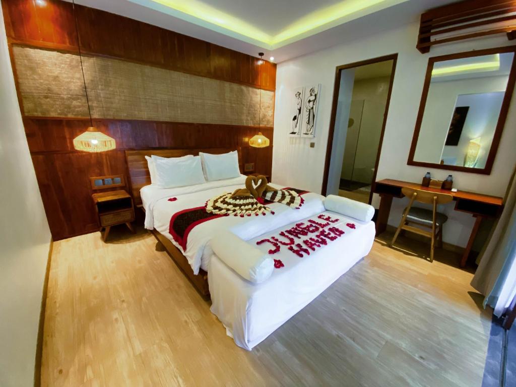 Postel nebo postele na pokoji v ubytování Jungle Haven Resort Central Ubud