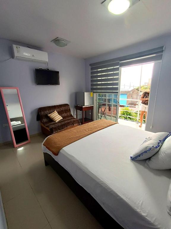 Postel nebo postele na pokoji v ubytování L'Vanna Hotel