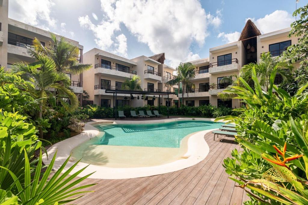 an image of a swimming pool at a resort at Xunik Tulum 205 1BR Condo in Tulum