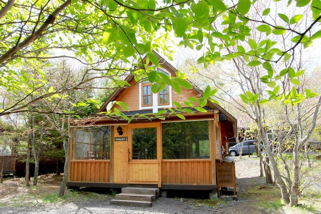 a tiny house in the middle of some trees at Kitakaruizawa Sweet Grass - Vacation STAY 22104v in Kita-karuizawa