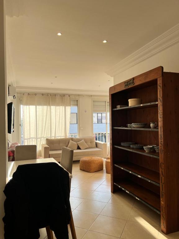 a living room with a couch and a table at Maison azur in Tunis