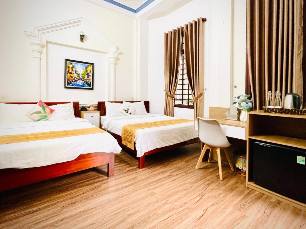 Giường trong phòng chung tại Eva Homestay