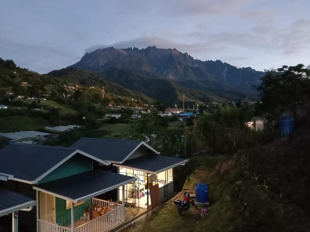 a house with a view of a mountain at Dtwinnie homestay lalita house in Kundasang
