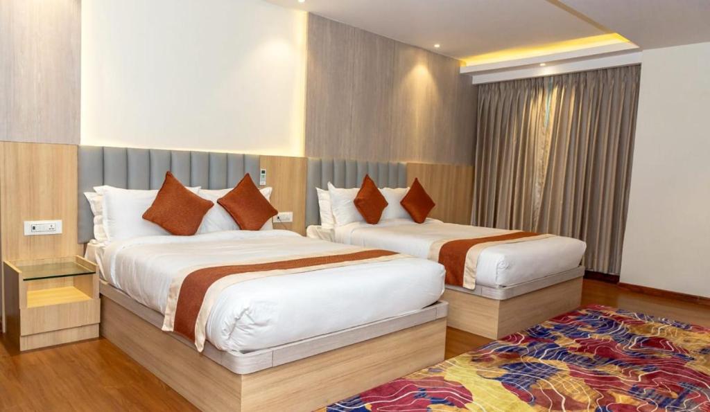 Postelja oz. postelje v sobi nastanitve Hotel Badrinath