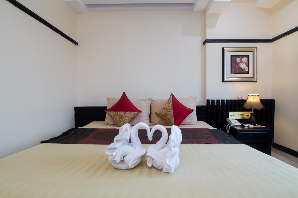 Postel nebo postele na pokoji v ubytování Salita Hotel